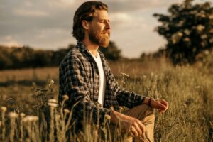 Bearded guy establishing connection with nature