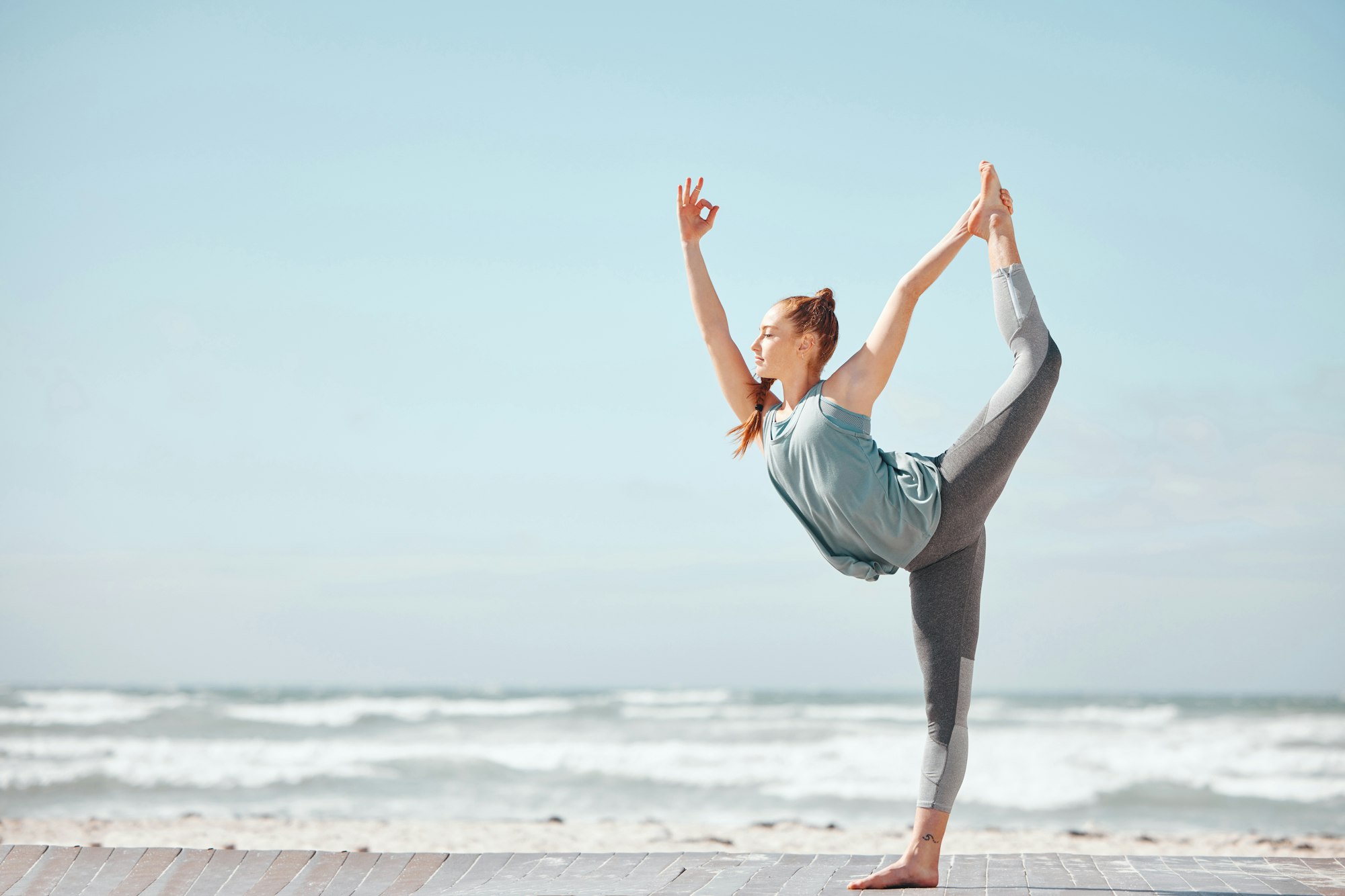 Health, fitness and a yoga with woman meditation pose at a beach, stretching and training workout.