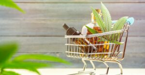 Supermarket trolley basket with cannabis Cbd oils, cbd purchasing concept