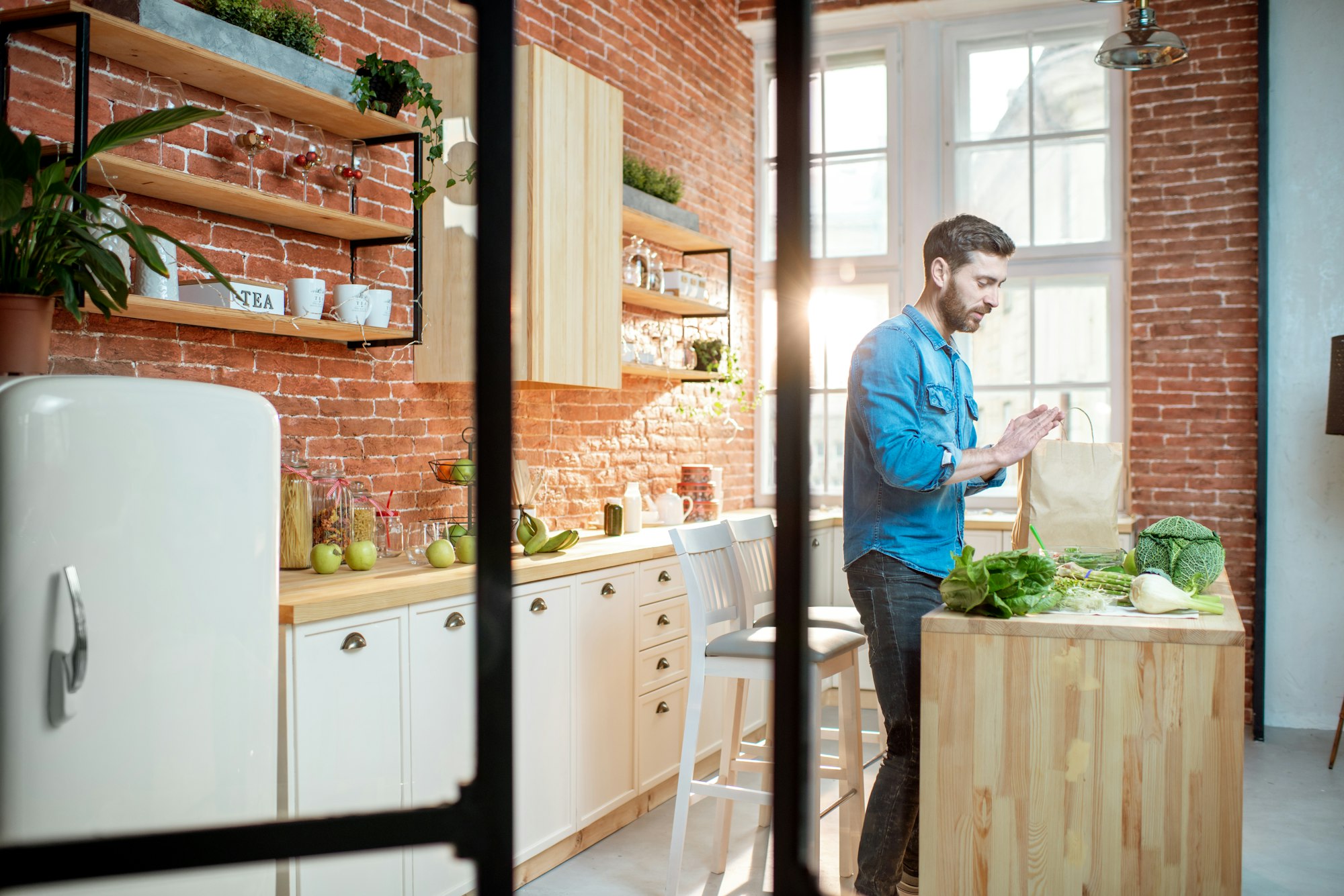 Man with healthy food on the kitchen