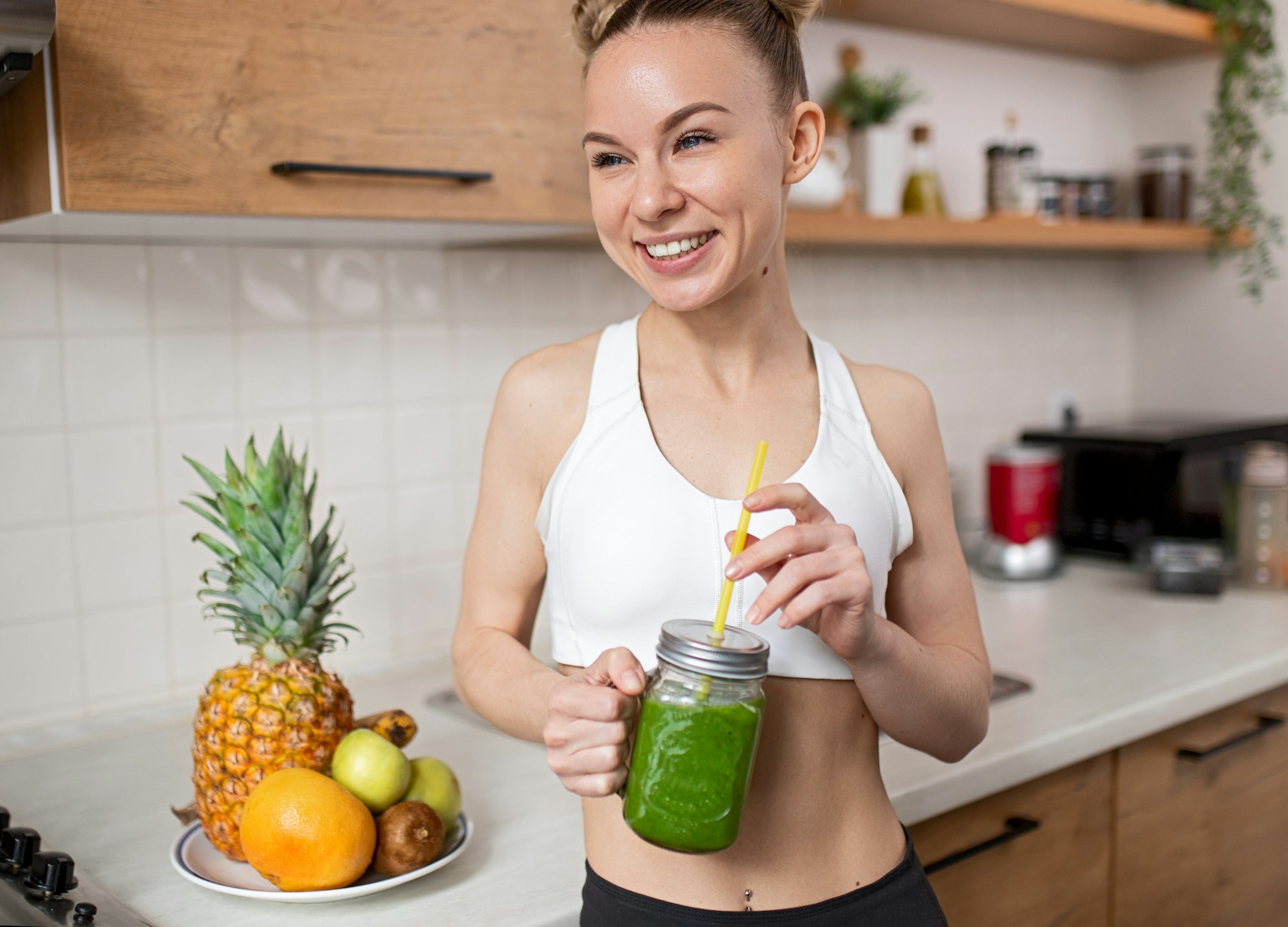 Optimistic sportswoman enjoying healthy drink