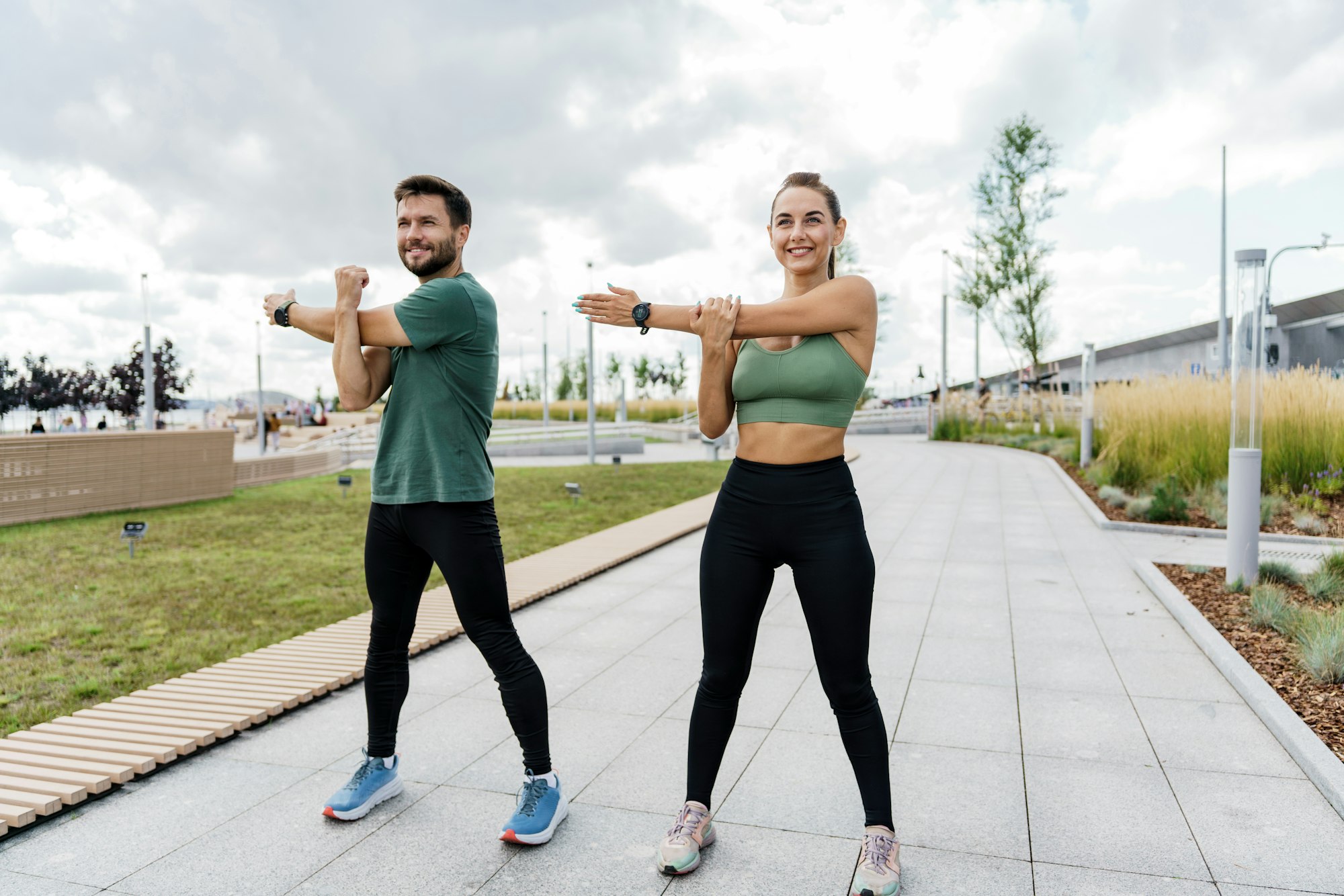 People in sportswear together, physical education and sports. Athletic man and woman train in fitnes