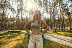 Smiling woman with closed eyes in nature