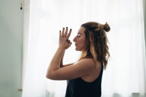 woman finding her chakra while meditating