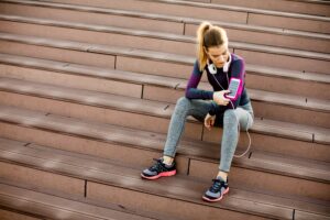 Young woman resting after jogging