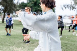 Mature chinese woman do tai chi outdoor