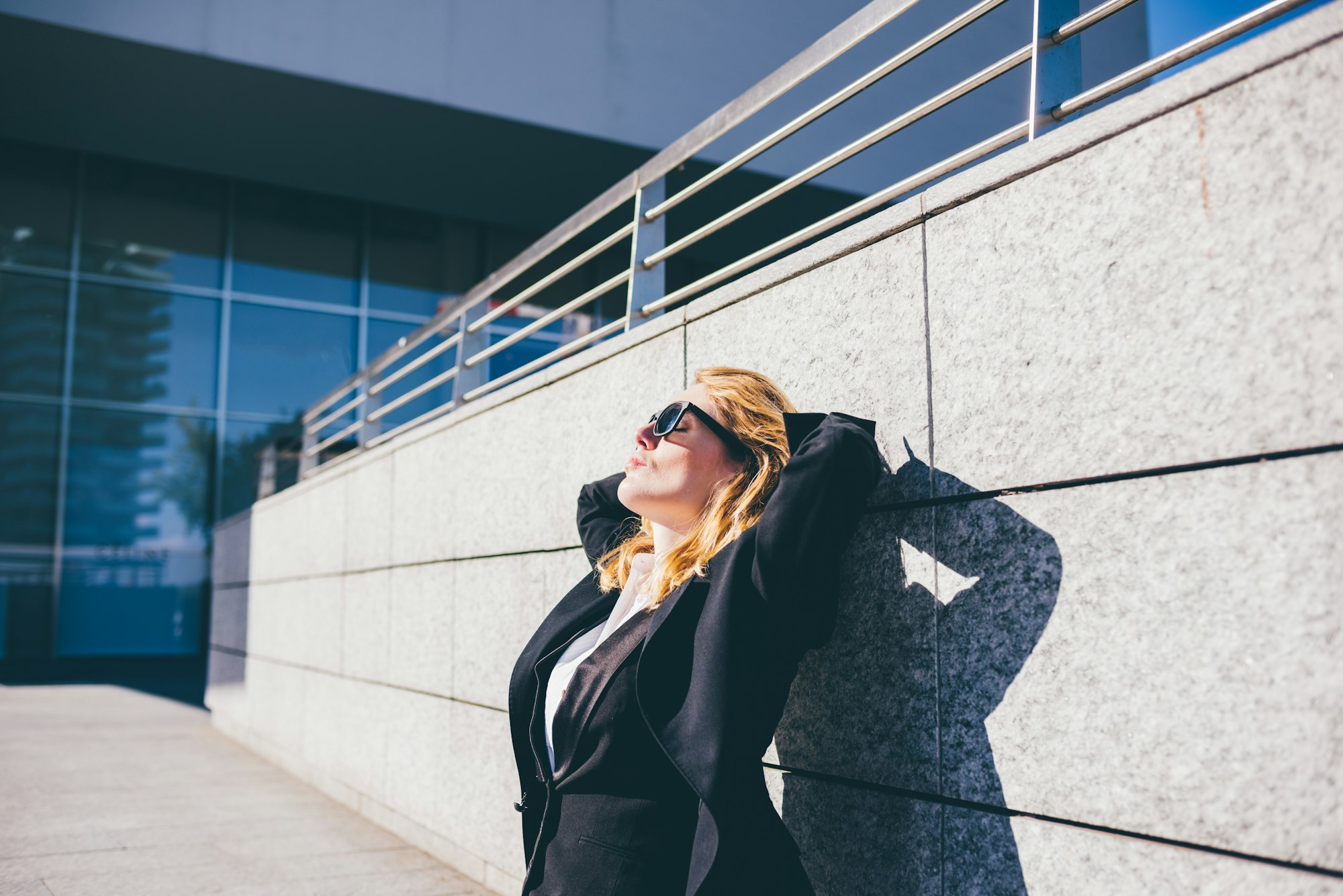 young contemporary businesswoman relaxing