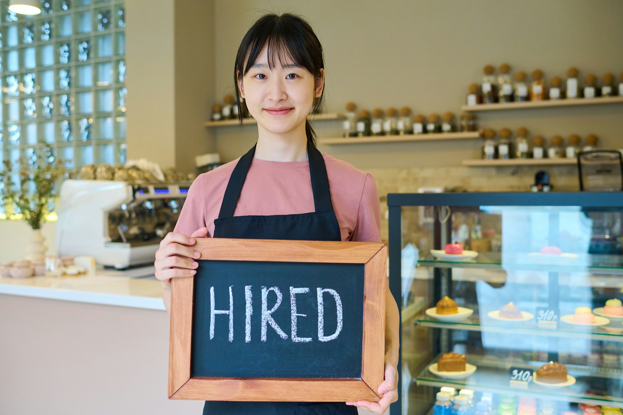 Young woman getting job of waitress